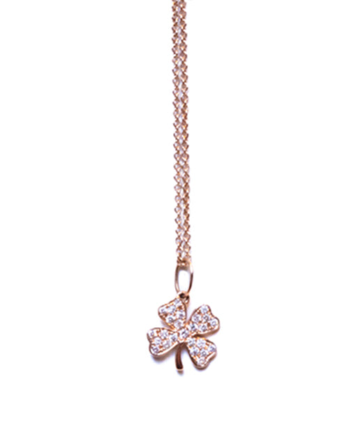 Small clover charm necklace in rose gold and pave diamonds on white background.