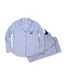 A blue and white striped long-sleeve button-down pajama shirt with a blue tree logo on the chest pocket, next to a folded pair of pants with an elastic drawstring waistband. The background is blank.