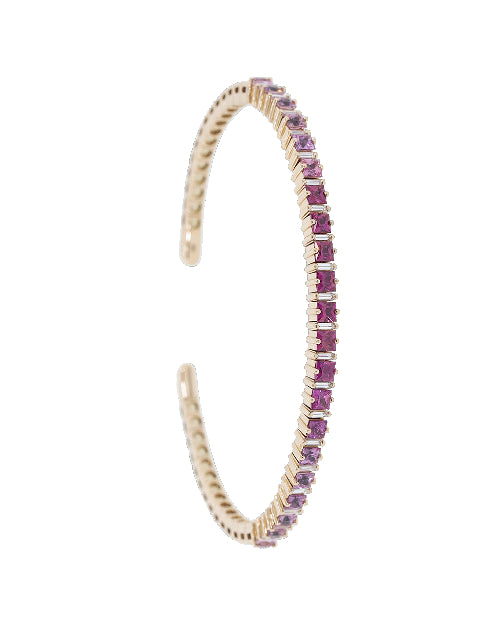 Thin gold bangle bracelet with pink sapphires. 