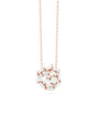 A rose gold chain with a circular pendant made up of rectangular diamonds. The chain is hanging over a white background.