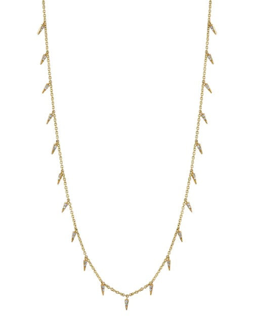 A gold chain necklace with evenly spaced crystal spikes along it. The background is plain white.