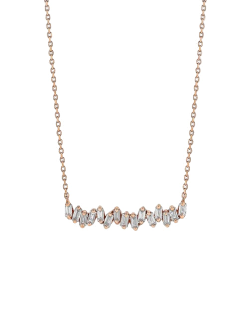 A rose gold chain necklace with baguette-cut diamonds aligned in row. The background is plain white.