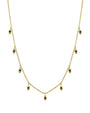 A gold necklace with evenly spaced teardrop-shaped pendants, each set with a dark-colored gemstone. The background is plain white.