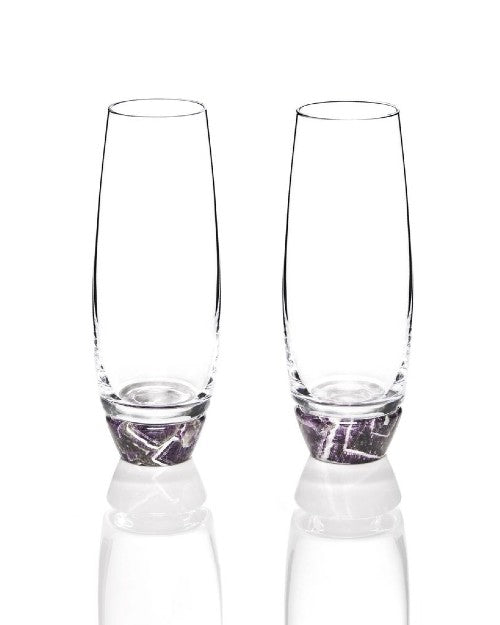 2 champagne glasses with amethyst at the bottom.