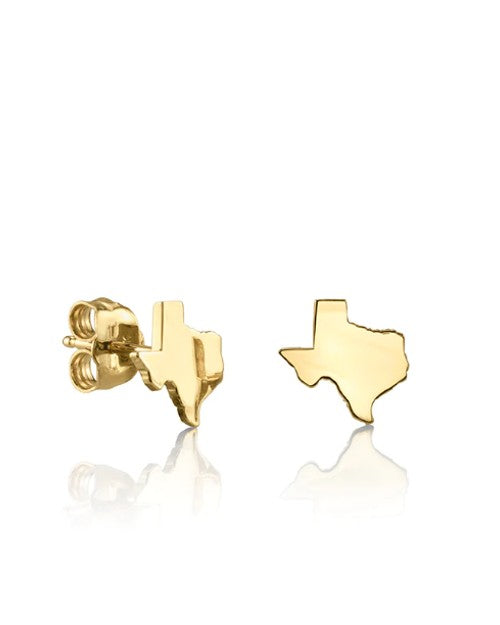 A pair of gold stud earrings shaped like the state of Texas. One earring is angled to show the butterfly backing. The background is white.