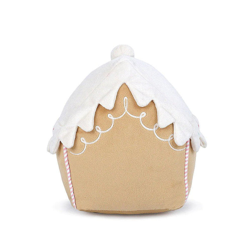 The back of a plush toy gingerbread house in front of a white background. The house has a white icing roof, decorated with white icing swirls and pink candy cane stripes on the sides.