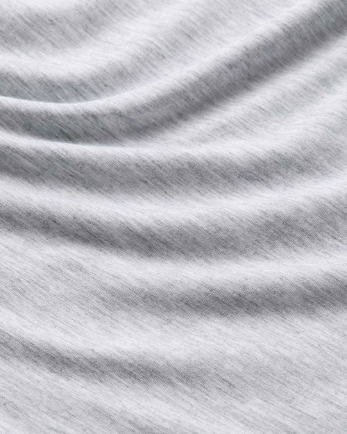 An up-close image of a grey shirt. 