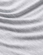 An up-close image of a grey shirt. 