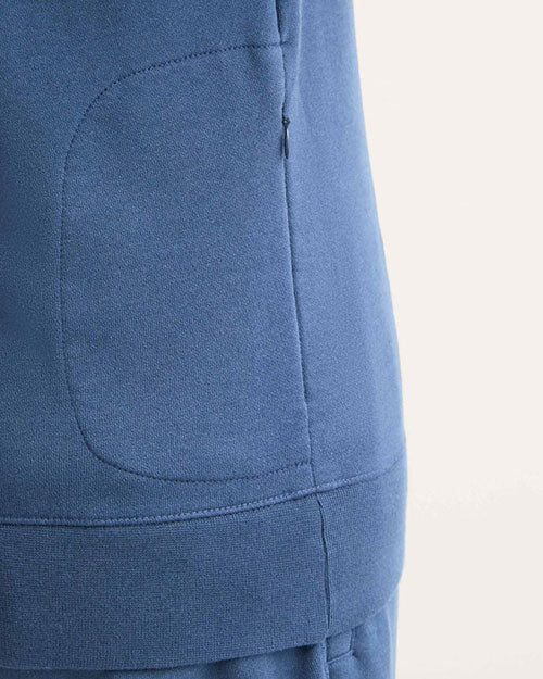  Blue sweatshirt seen from the back, showcasing a central pocket design.
