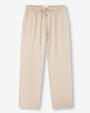 Beige pants featuring pockets and elastic cuffs, designed for comfort and practicality.