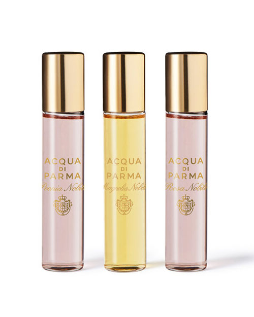  A beautifully arranged Acqua di Parma perfume gift set showcasing various scents in stylish bottles.