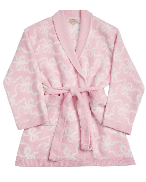 A soft pink bathrobe with a thin white bows pattern. The bathrobe has long sleeves, a shawl collar, and a matching pink belt tied around the waist.