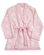 A soft pink bathrobe with a thin white bows pattern. The bathrobe has long sleeves, a shawl collar, and a matching pink belt tied around the waist.