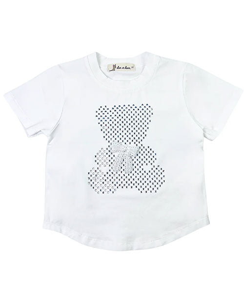 This white t-shirt features small stones in a bear shape with a bow accent on a white background.