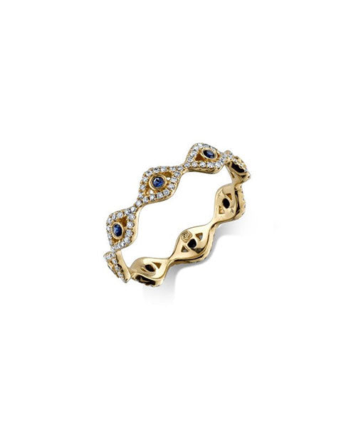 Gold band with diamond and blue sapphire evil eyes around the band.