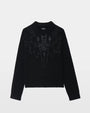 A black sweater with rhinestone embellishments on a white background. 
