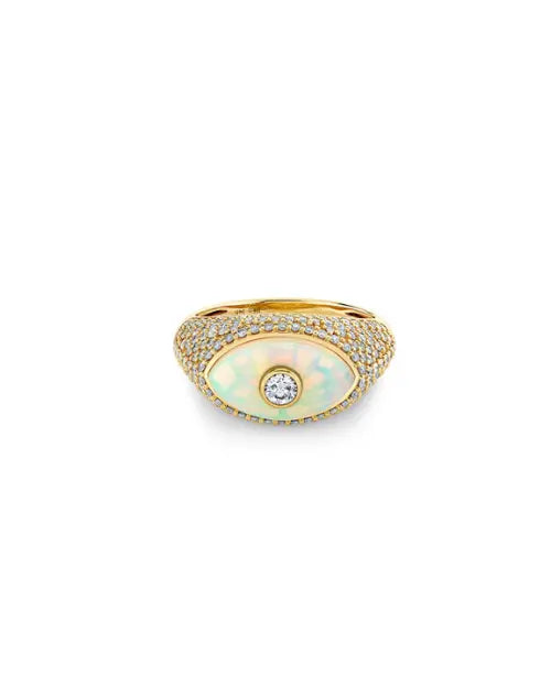 A diamond and gold ring, with an iridescent opal center in the shape of an eye, with a large diamond in the center. 