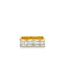 Gold and diamond ring against a white background. 