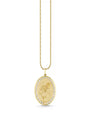 Image of a pendant necklace engraved with an image of a flower and outlined in diamonds. 