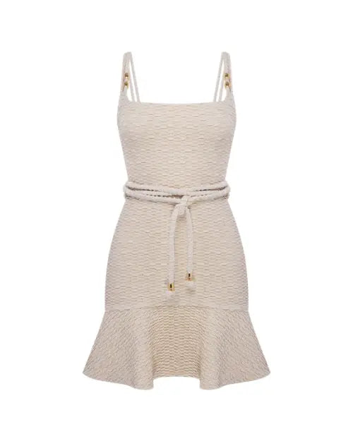 Image of a white mini dress with a rope tied at the waist with gold beads on the straps and ties on a white background. 