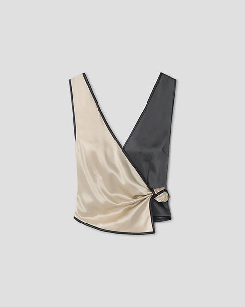 Beige and dark green satin wrap-style top with a deep V neckline and side tie detail.
