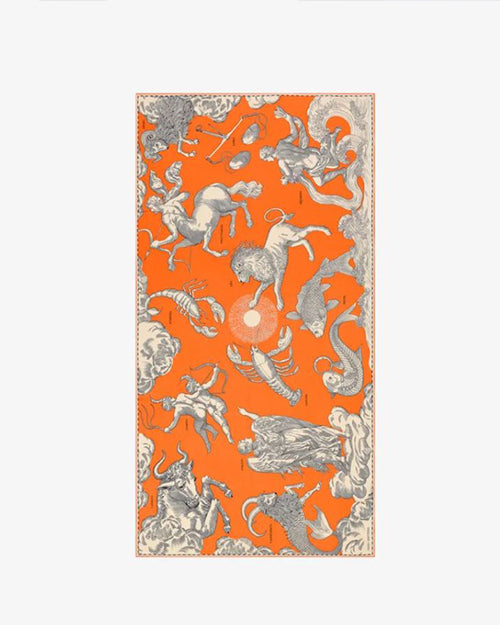 An orange and beige scarf with flowing patterns of various animals and mythical creatures. 