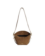 A brown suede handbag with a long strap, featuring an embossed floral pattern on the front, gold-tone hardware, and a black interior. The bag has a flap closure with a button.