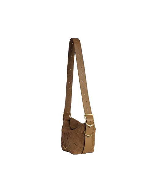 A brown leather shoulder bag with an adjustable strap featuring multiple holes and two gold-colored buckles. The bag has a flap closure and embossed patterns on its surface.