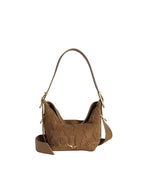 A brown suede handbag with a single shoulder strap and gold-tone hardware. The bag features an embossed floral pattern on the front and sides, with a small gold logo at the bottom center. The strap is adjustable with gold buckles on each side.
