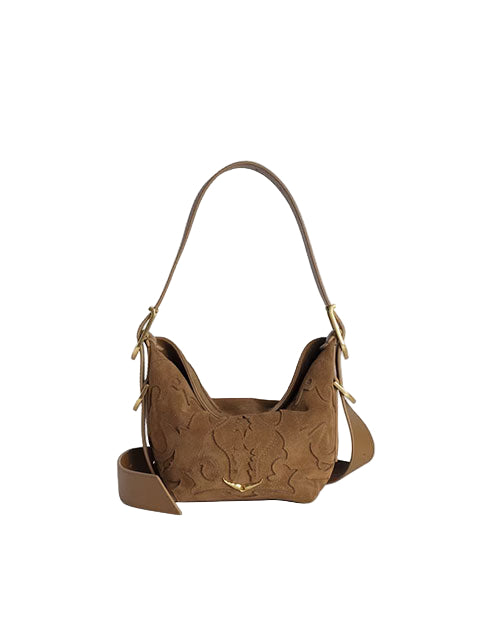 A brown suede handbag with a single shoulder strap and gold-tone hardware. The bag features an embossed floral pattern on the front and sides, with a small gold logo at the bottom center. The strap is adjustable with gold buckles on each side.