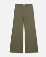 Olive green denim trousers with a wide leg fit and stitched hem. The trousers are paired with a light brown belt with a gold buckle and white top.