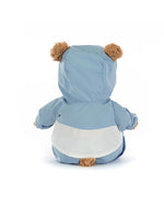 Back view of a plush teddy bear wearing a light blue hooded jacket with white trim, showing brown ears and a fluffy tail sticking out from the jacket.