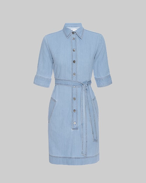 A light blue denim dress with mid arm short sleeves, a collar, and a front button closure with silver hardware. The dress features a waist tie detail and appears to be knee-length. It is displayed against a plain, neutral background.