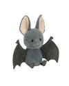 Plush bat toy with soft grey fur, large fluffy ears with pink inner parts, black eyes, a small nose, black stitched wings, and visible feet.