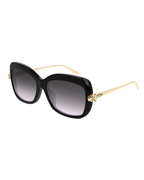 Sunglasses with a thick frame in black, the arms of the sunglasses are thin and gold-colored, with an intricate, leopard print detail near the hinges.