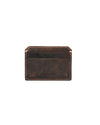 A dark brown leather card holder with visible stitching along the edges. The card holder has a central pocket and one slot on the front, with an embossed logo near the bottom edge. 