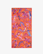 A vibrant patterned scarf featuring a dense array of tropical motifs in shades of orange, red, purple and additional colors. The design includes various stylized birds perched and in flight, interspersed with lush foliage and botanical elements such as leaves and flowers.