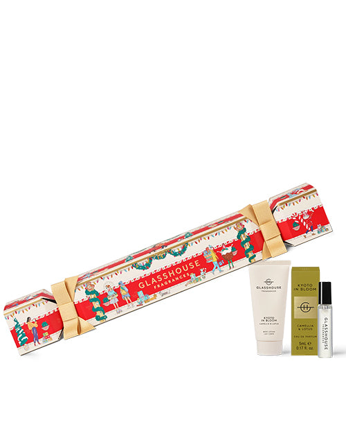Glasshouse lotion and fragrance vial product set with festive packaging on a white background
