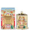Decorative candle and packaging with festive design on a white background