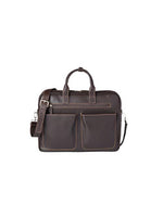 A dark brown leather briefcase with a front pocket and silver-colored metal accents. The briefcase has 
 sturdy handles on top and an adjustable shoulder strap attached to the sides.