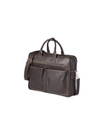 Side view of a dark brown leather briefcase with a front pocket and silver-colored metal accents. The briefcase has 
 sturdy handles on top and an adjustable shoulder strap attached to the sides.