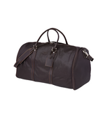 A high-quality leather duffel bag with a smooth finish. It features two rolled leather handles and a detachable shoulder strap. The bag’s contrasting stitching along the edges adds to its design, and it includes a luggage tag. A small logo is embossed on the top center.