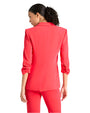 Back view of a person wearing a red suit against a white background. The blazer has three-quarter length sleeves with slight ruching at the cuffs.