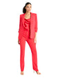 A person is wearing a bright red suit consisting of a blazer and matching pants. The blazer has three-quarter length sleeves with slight ruching at the cuffs, a single button closure, and notched lapels. The person is also wearing a red top underneath the blazer. The background is plain white.