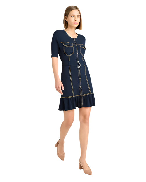 Woman wearing a navy blue dress with denim details on a white background