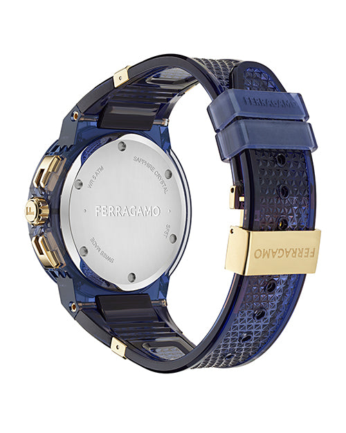 Back view of a Ferragamo wristwatch with a blue textured strap and gold accents. The silver case back is engraved with "FERRAGAMO" in the center, along with "SWISS MADE," "SAPPHIRE CRYSTAL," and "WATER RESISTANT." The gold clasp also features the Ferragamo logo.