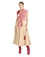 Person wearing a sleeveless red floral top tied at the waist, beige A-line skirt with red accents, and red knee-high boots.