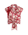 Red and white floral patterned blouse on a white background