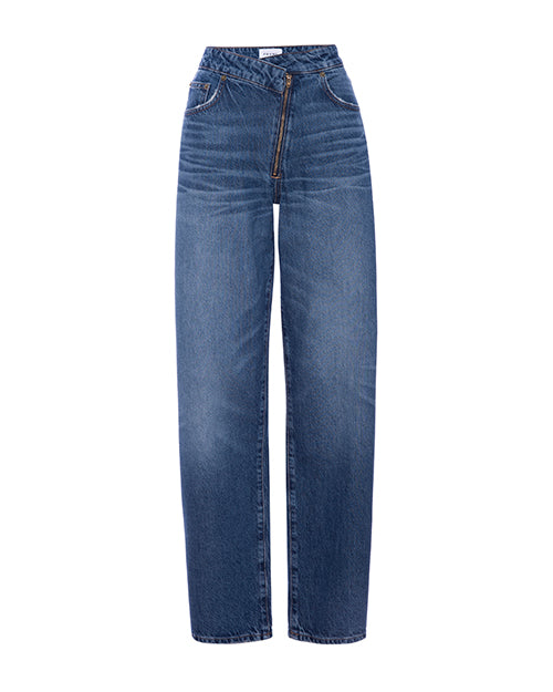 A pair of high-waisted jeans in a medium blue wash. The jeans have a relaxed fit through the hips and thighs, tapering slightly towards the ankle. The waist has a crossing over design with a diagonal gold zipper fly.