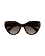 Front view of tortoiseshell colored, narrow cat-eye sunglasses with brown lenses.